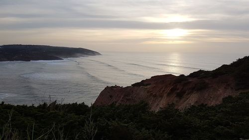 Scenic view of sea against sky during sunset