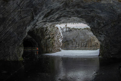 Scenic view of frozen lake seen through tunnel