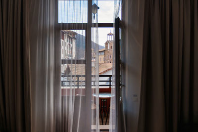 Buildings seen through window at home