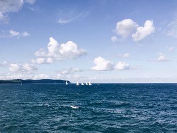 Scenic view of sea against cloudy sky