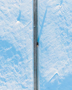 High angle view of snow covered pole