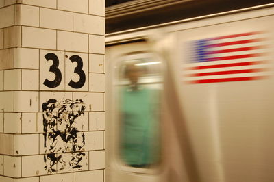 Blurred motion of subway train with american flag