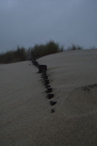 Scenic view of beach against clear sky