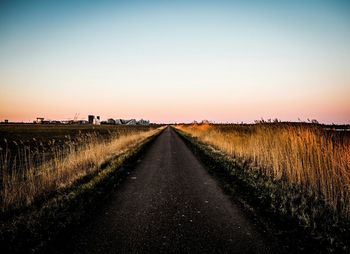 Road passing through field