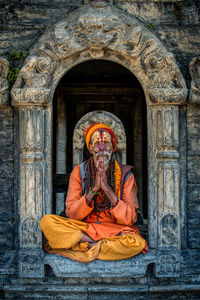 Low angle view of a statue against building