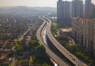 High angle view of street amidst buildings in city