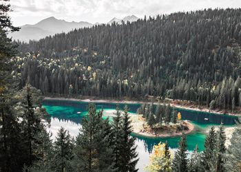 Scenic view of lake and mountains against sky