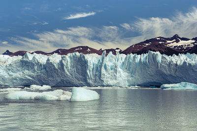 Scenic view of frozen sea against sky