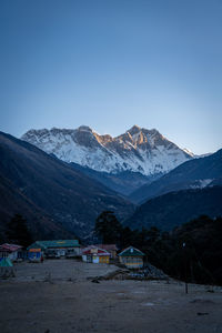 Scenic view of snowcapped mountains against clear sky