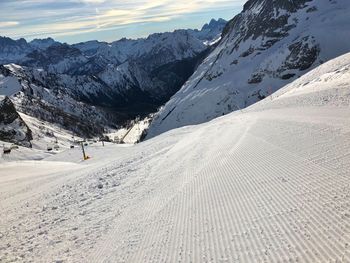 Scenic view of snowcapped mountains against sky