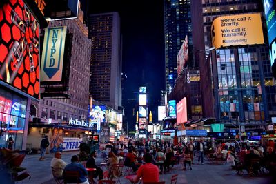 People on city street at night