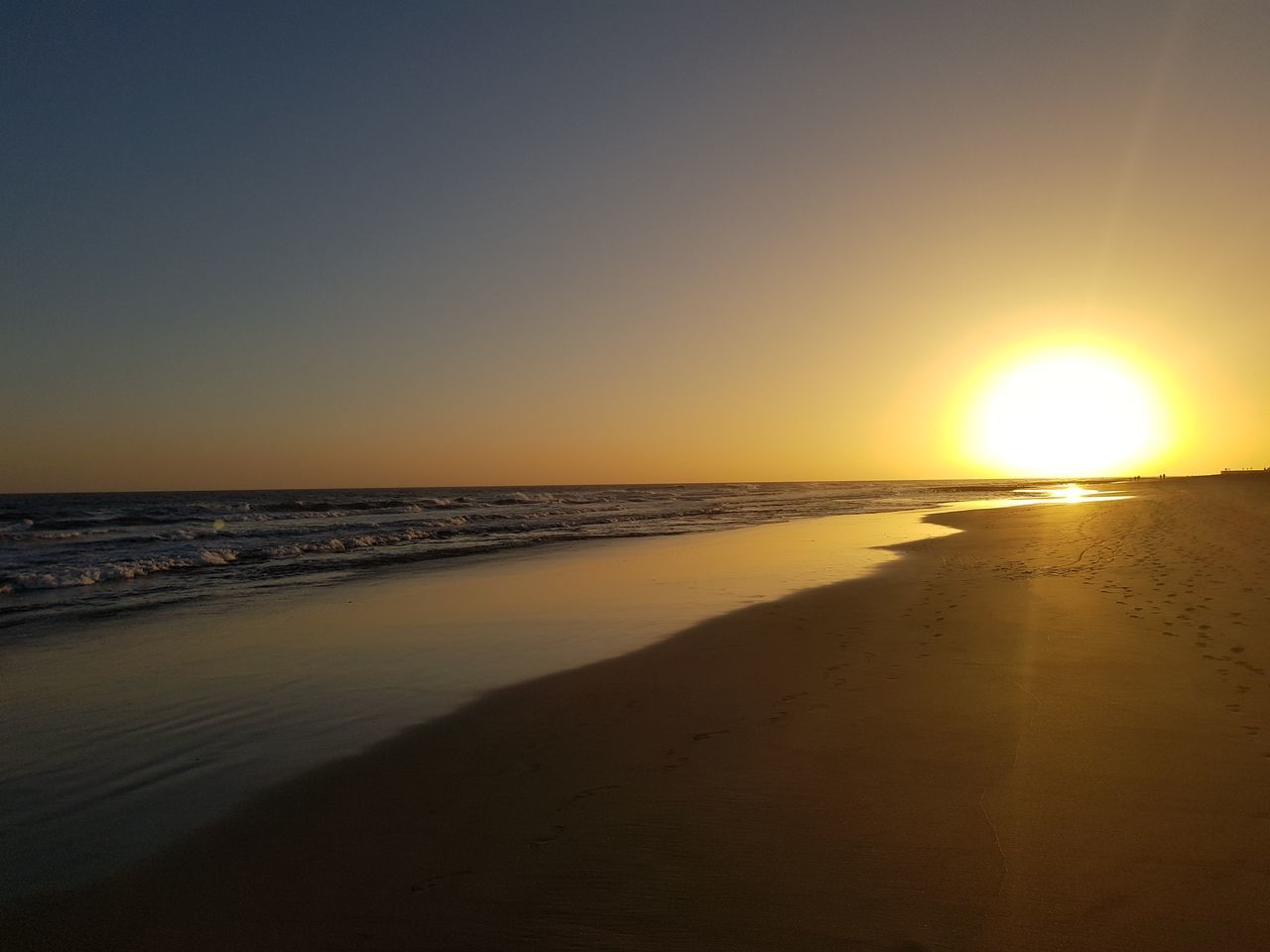 SCENIC VIEW OF SUNSET OVER SEA