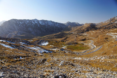 Scenic view of snowcapped mountains against clear sky