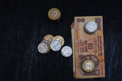 High angle view of coins on table