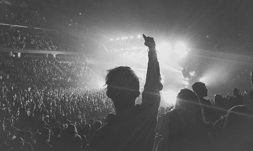 People enjoying music concert at night