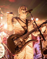 Man wearing costume performing on stage