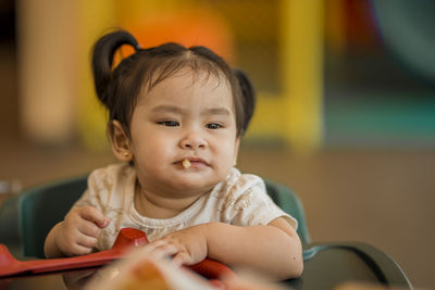 Close-up of cute girl eating food