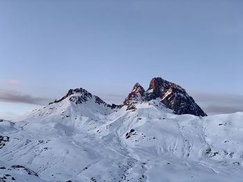 Scenic view of snowcapped mountain against sky