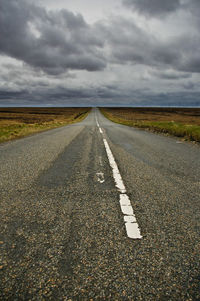 Road amidst landscape against sky