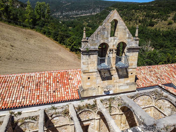 High angle view of cross on roof of building