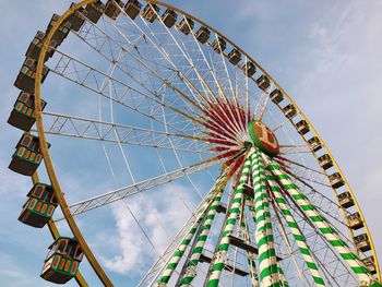 Low angle view of ferris wheel against sky