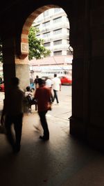 People walking on road in city