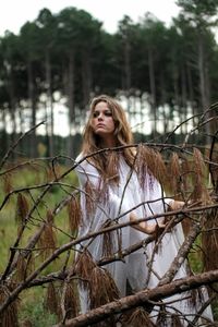 Portrait of young woman in forest