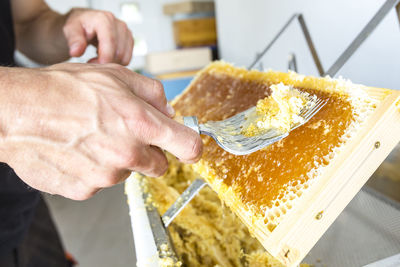 Close-up of man preparing food