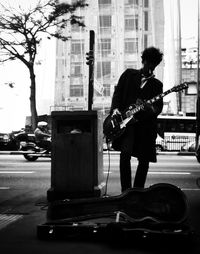 Woman standing on city street