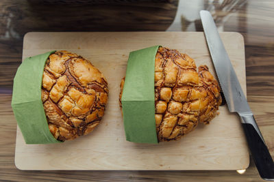 High angle view of bread on cutting board