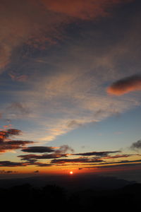 Low angle view of dramatic sky during sunset