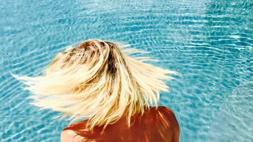 Woman looking at swimming pool