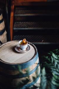 Hot toddy teacup drink on whiskey barrel