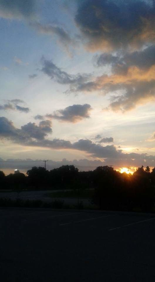 SCENIC VIEW OF SILHOUETTE MOUNTAIN AGAINST SKY AT SUNSET