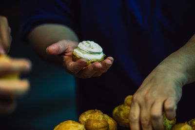 Close-up of man holding fruit