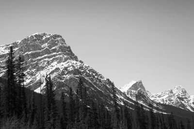 Low angle view of snowcapped mountain against clear sky