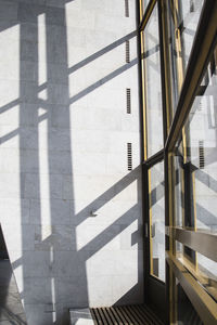 Shadows in a bright interior with marble walls on a bright sunny day. 