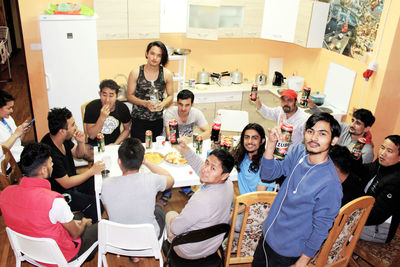 High angle view of people on table