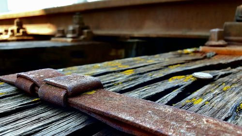 Close-up of rusty metal on table