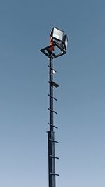 Low angle view of communications tower against clear sky