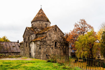 Historic building against sky during autumn