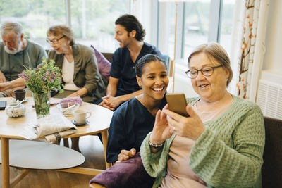 Group of people sitting on table