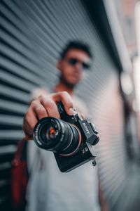 Man photographing camera
