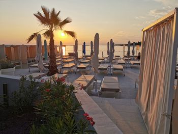 Scenic view of swimming pool at beach during sunset