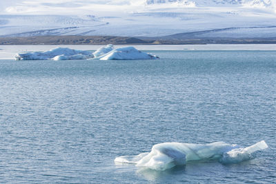 Scenic view of icebergs in lake during winter in iceland