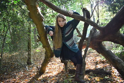 Portrait of young woman in forest