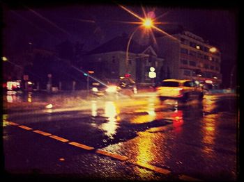 Illuminated city street at night