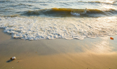 High angle view of waves on beach