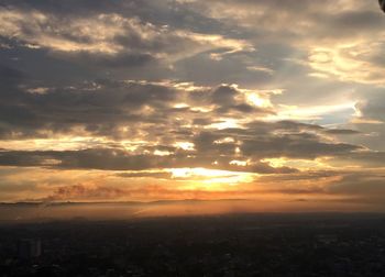 Scenic view of sunset over city