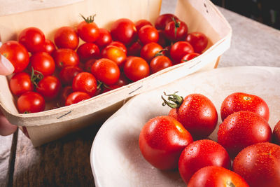 High angle view of cherries in container on table